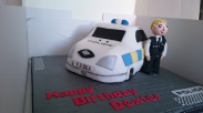 Police car birthday cake with a policeman