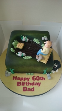 60th birthday cake with man fishing and a dog